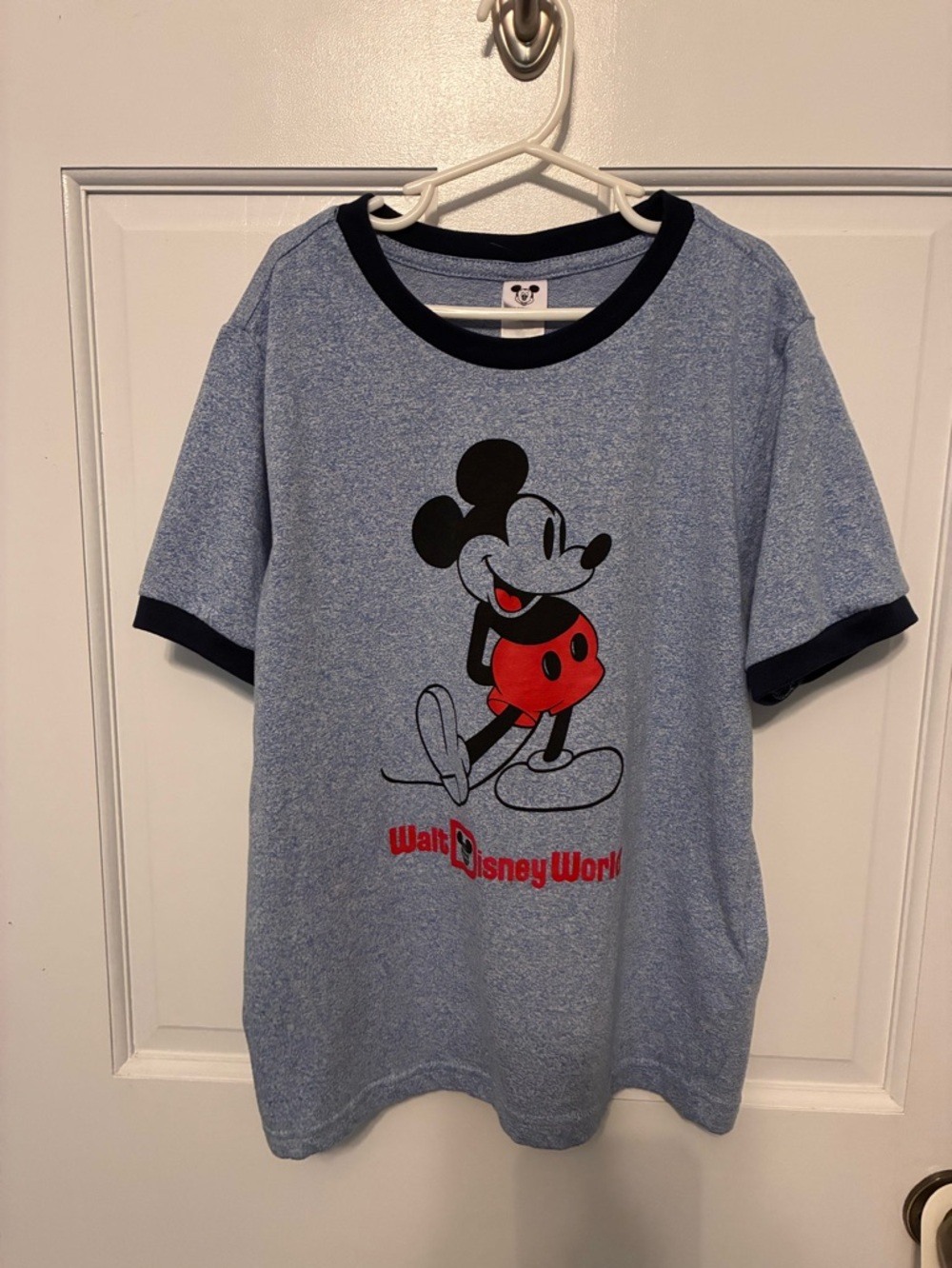 Disney light blue t-shirt with red and navy. Size S.